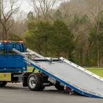 Tow truck with sliding platform