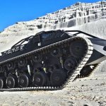 Crawler all-terrain vehicle on crushed stone