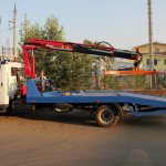 Crane manipulator tow truck