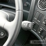 The gearshift lever is located immediately under the steering wheel